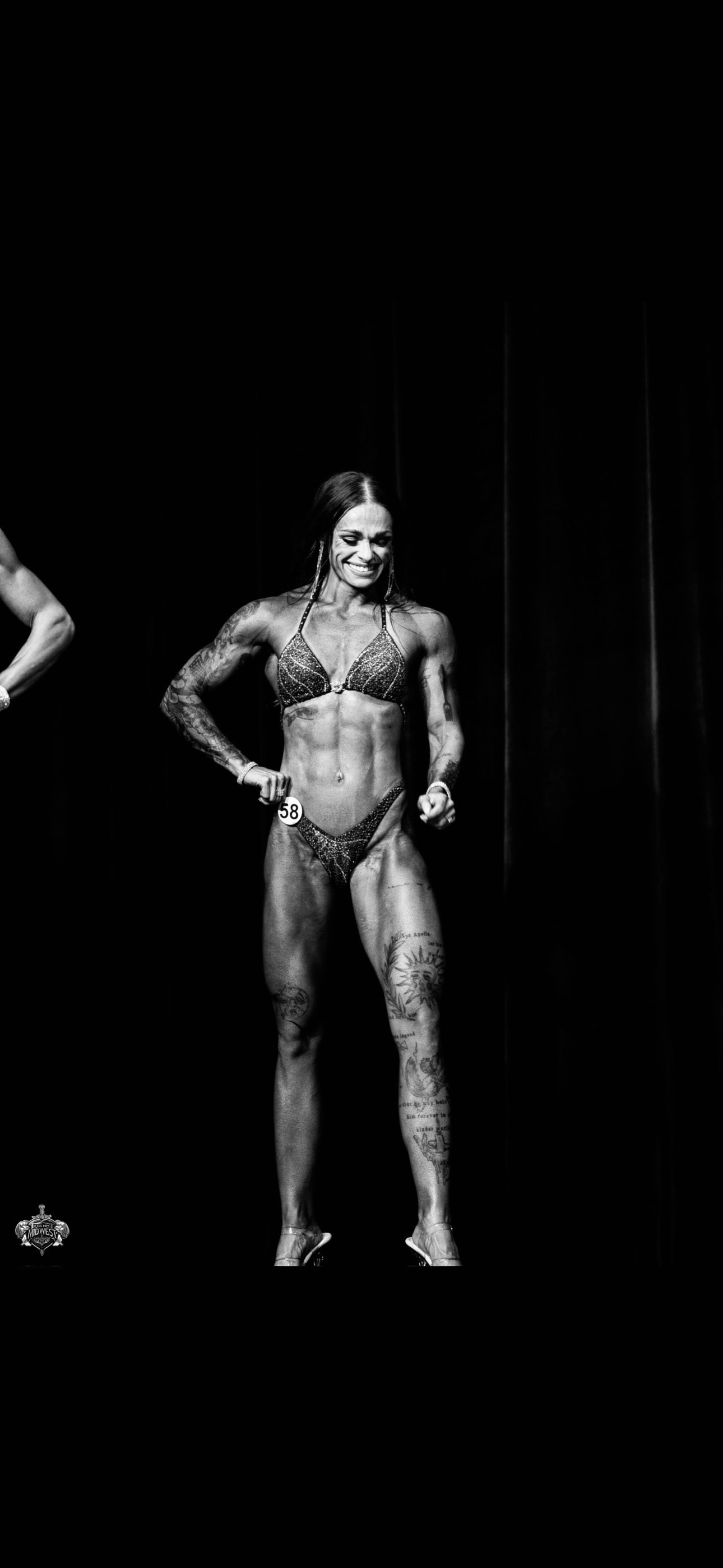 Kalee on a bodybuilding competition stage
