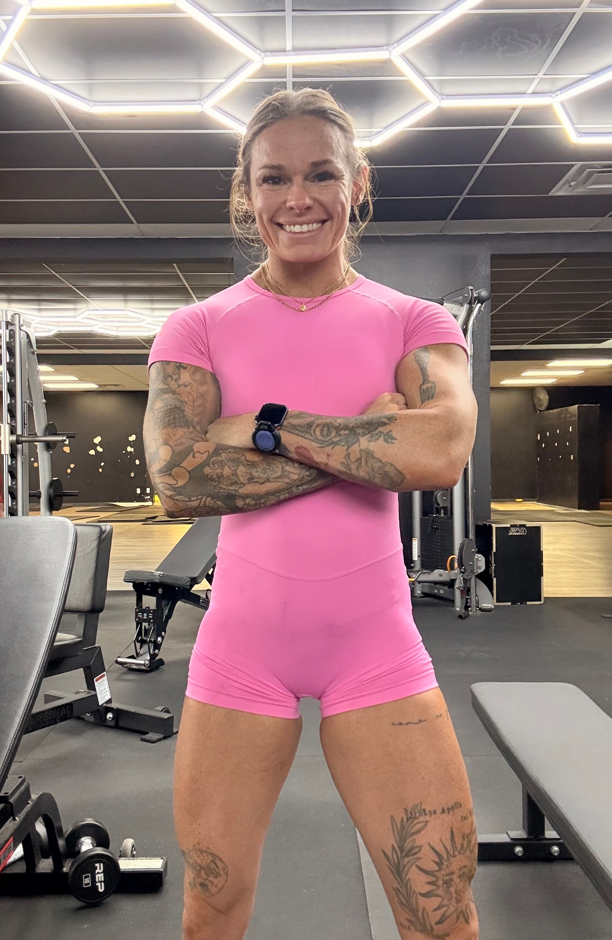 Kalee, KaleFit Coaching founder, standing in a gym